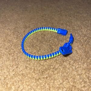 Blue and neon yellow zipper kids bracelet. Never worn it